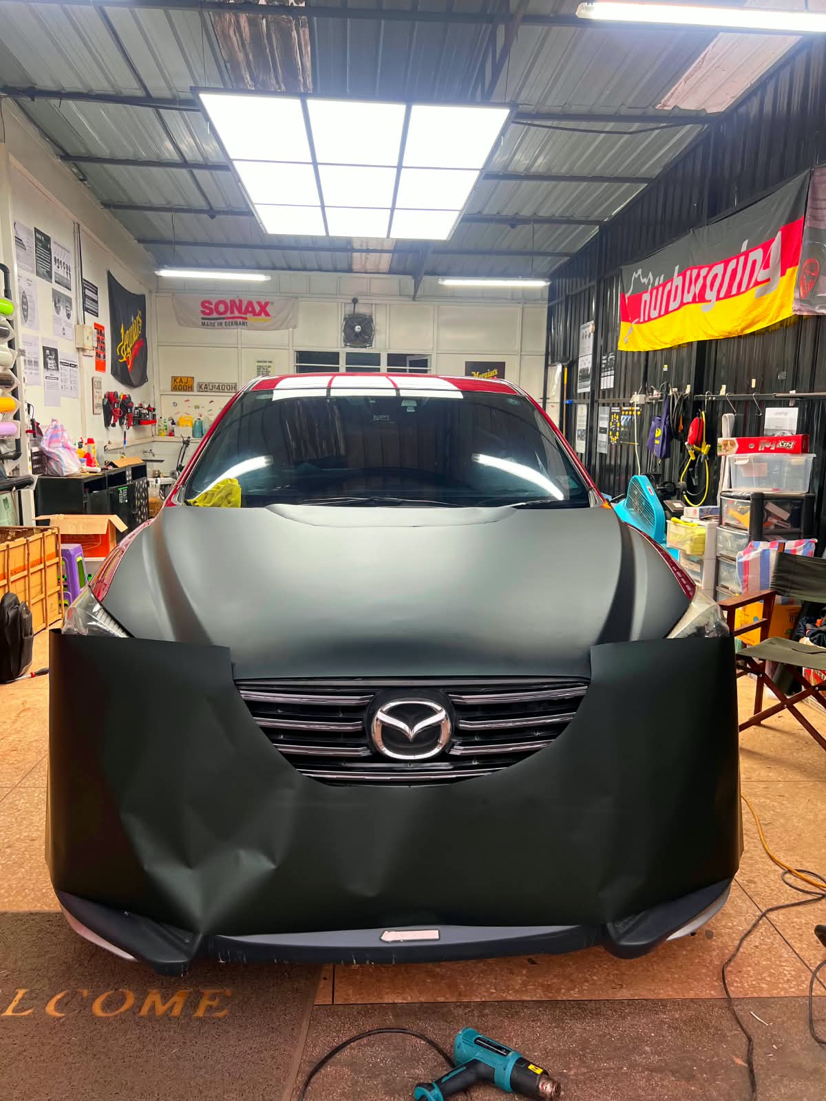 Mazda CX-5 SUV before the matte black vehicle wrap